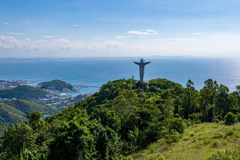 Aerial view of Vung Tau Back Beach curving along turquoise water with the Christ statue hill in the distance (2)